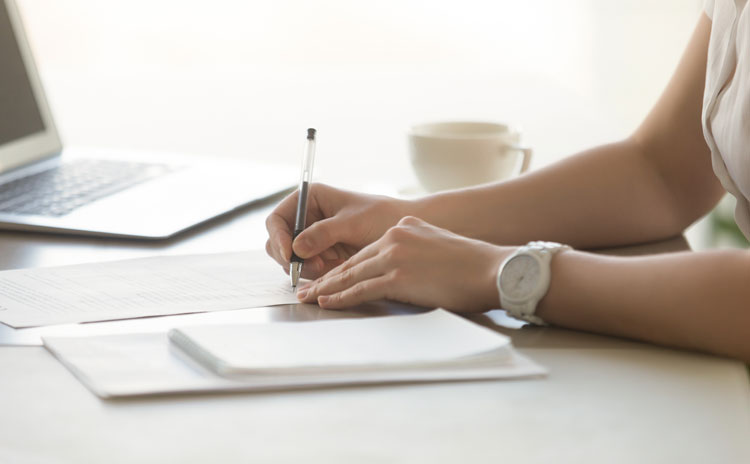 image showing female filling out application for free legal services
